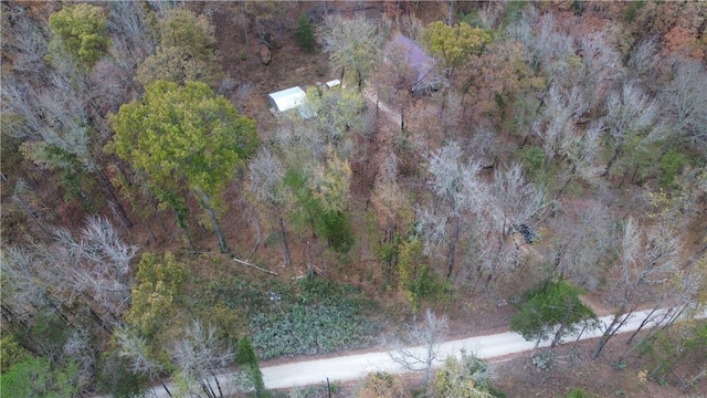 birds eye view of property with a wooded view