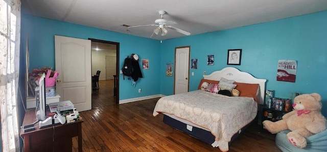 bedroom featuring a ceiling fan, dark wood finished floors, visible vents, and baseboards