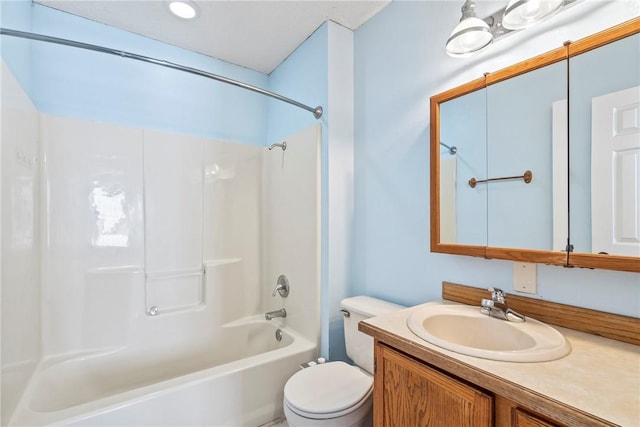 full bathroom featuring toilet, tub / shower combination, and vanity