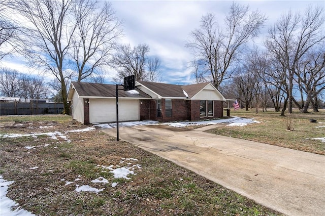 view of front of house featuring concrete driveway, brick siding, and an attached garage