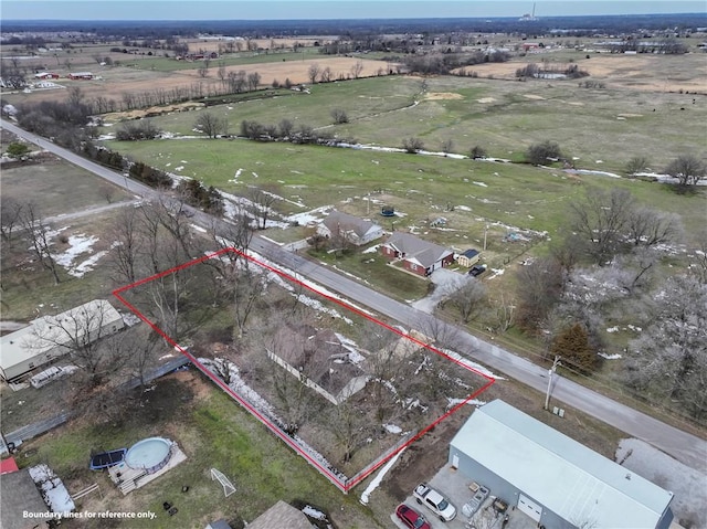 birds eye view of property featuring a rural view