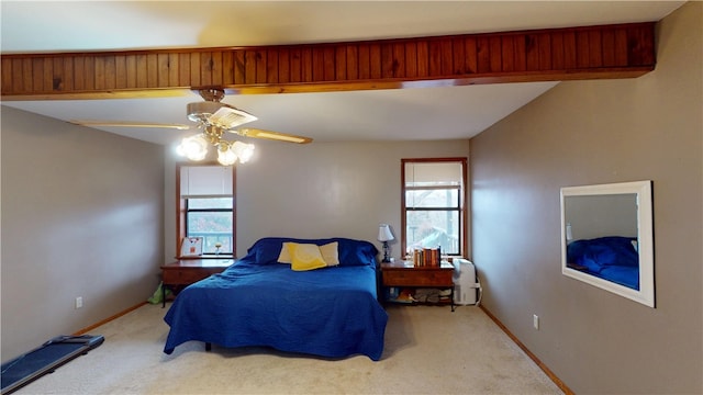 carpeted bedroom featuring ceiling fan and baseboards