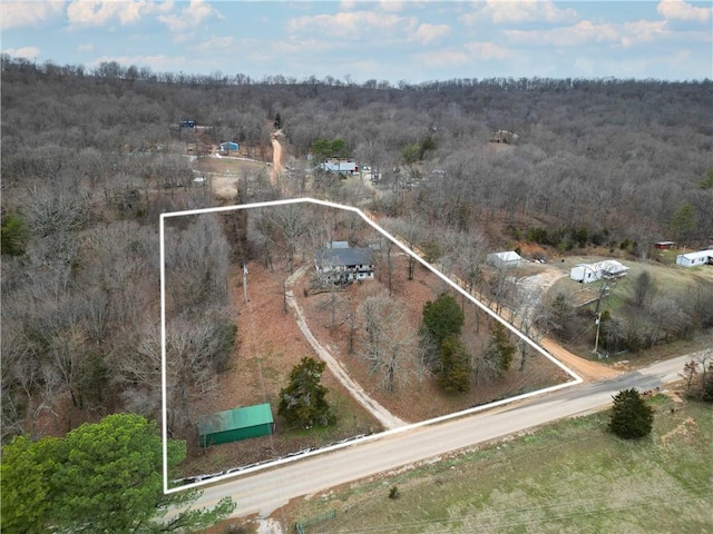 drone / aerial view with a view of trees