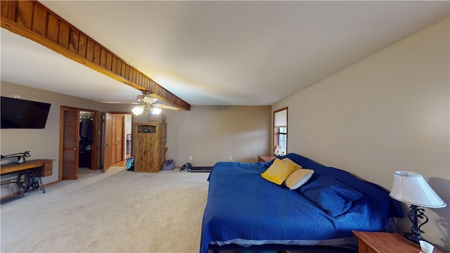 bedroom featuring baseboards, a ceiling fan, and light colored carpet