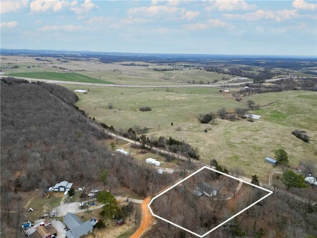 birds eye view of property featuring a rural view