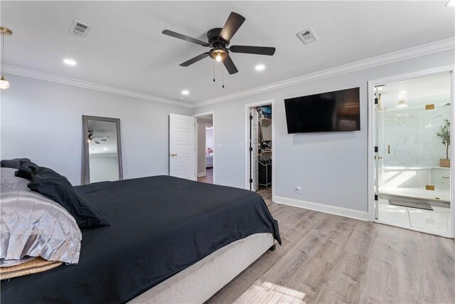 bedroom featuring light wood-style floors, baseboards, a spacious closet, and visible vents