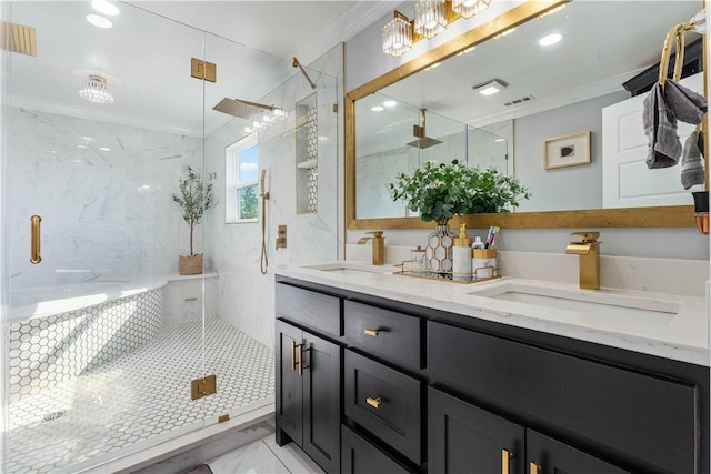 bathroom with ornamental molding, marble finish floor, a sink, and a marble finish shower