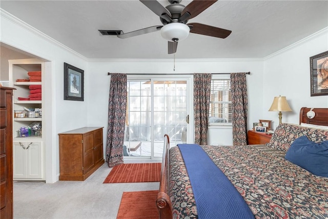 bedroom with light carpet, ornamental molding, visible vents, and a ceiling fan