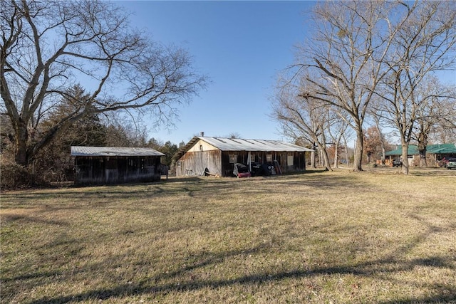 view of yard with an outbuilding and a pole building