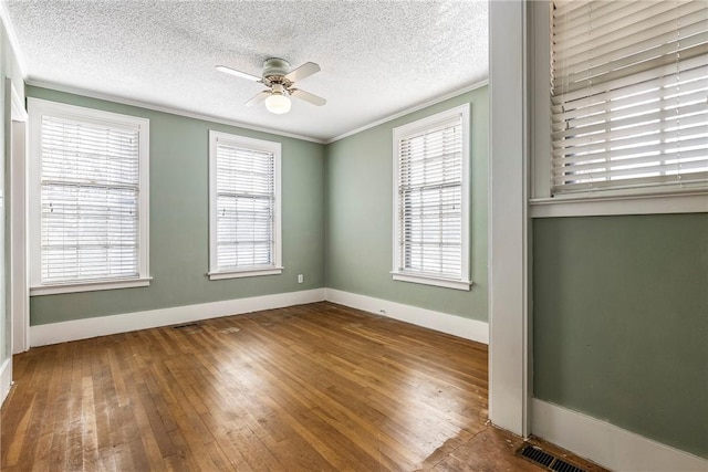 510 W Central Ave, Bentonville, AR 72712 - unfurnished room with a ceiling fan, crown molding, a textured ceiling, and wood finished floors