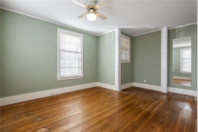 510 W Central Ave, Bentonville, AR 72712 - unfurnished room with a textured ceiling, baseboards, wood finished floors, and crown molding