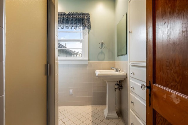 510 W Central Ave, Bentonville, AR 72712 - bathroom with a wainscoted wall, tile walls, and tile patterned floors