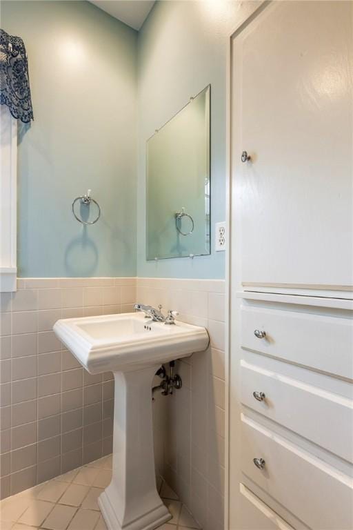 510 W Central Ave, Bentonville, AR 72712 - bathroom with tile patterned flooring, tile walls, and wainscoting