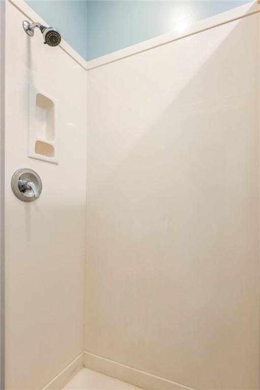 510 W Central Ave, Bentonville, AR 72712 - bathroom with a shower and baseboards