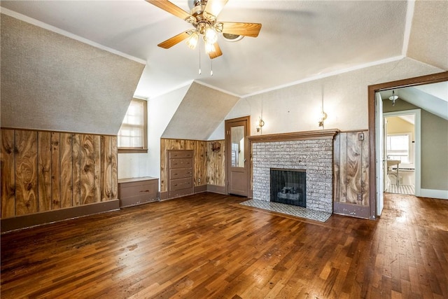 510 W Central Ave, Bentonville, AR 72712 - unfurnished living room with dark wood-style floors, wooden walls, lofted ceiling, and crown molding