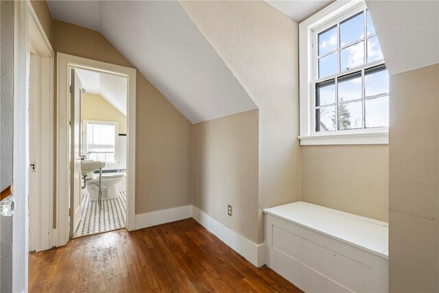 510 W Central Ave, Bentonville, AR 72712 - bonus room featuring dark wood-style flooring, vaulted ceiling, and baseboards