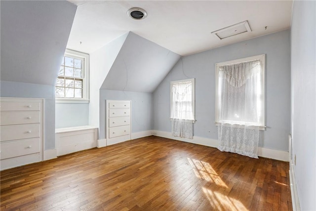 510 W Central Ave, Bentonville, AR 72712 - bonus room featuring vaulted ceiling, baseboards, and wood finished floors