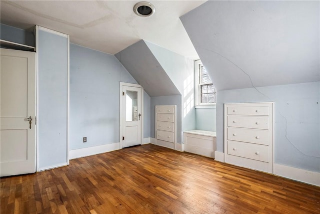 510 W Central Ave, Bentonville, AR 72712 - bonus room with vaulted ceiling, baseboards, and wood finished floors