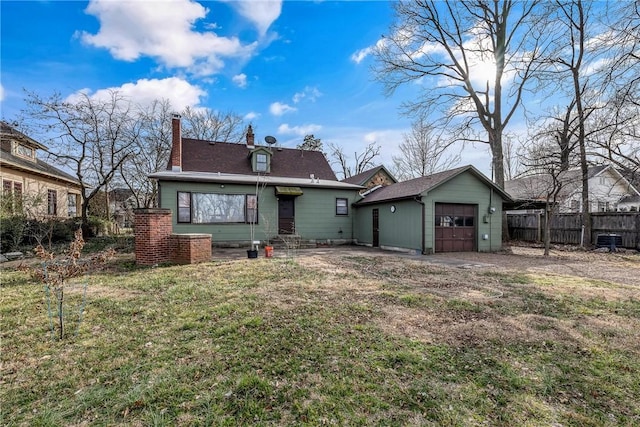 510 W Central Ave, Bentonville, AR 72712 - rear view of house with a garage, a yard, fence, and entry steps