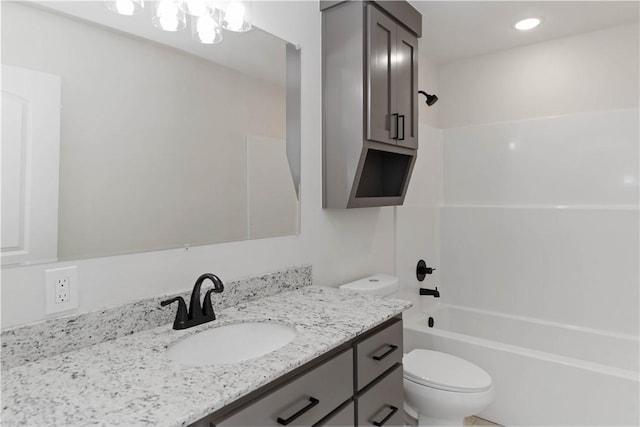 bathroom with toilet, shower / tub combination, and vanity