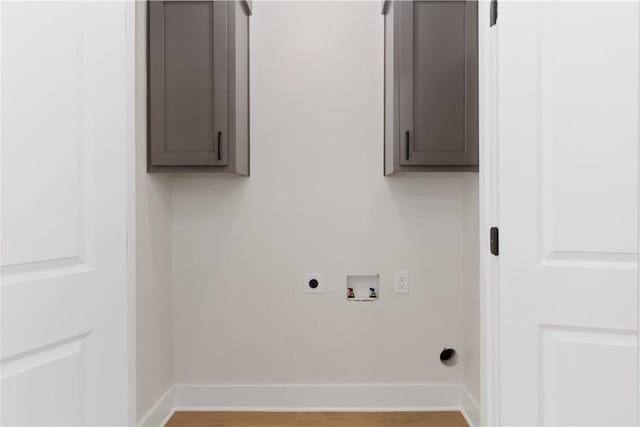 laundry room with cabinet space, baseboards, washer hookup, and hookup for an electric dryer