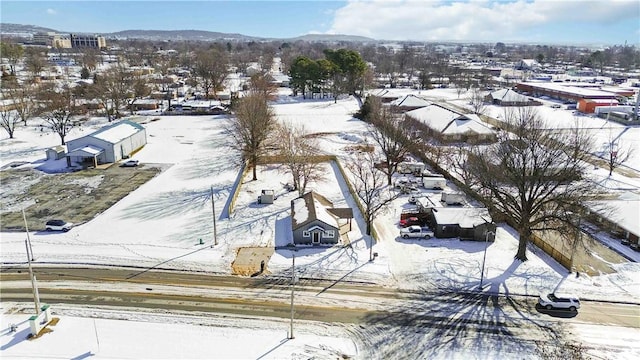 snowy aerial view featuring a residential view