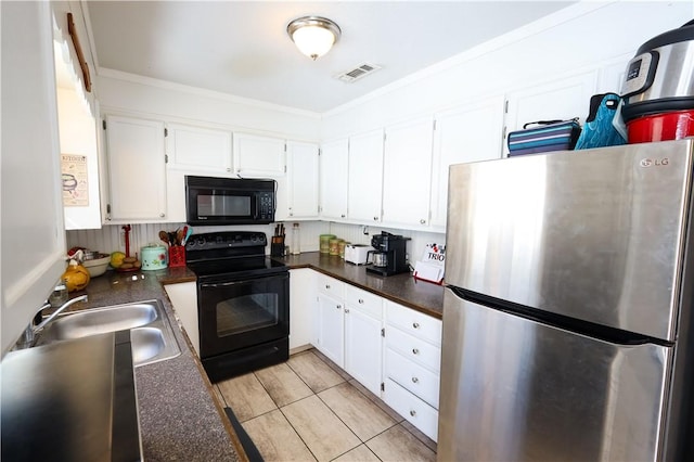 kitchen with black appliances, a sink, and white cabinetry