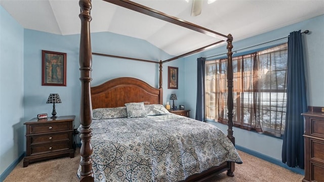 bedroom with light colored carpet, lofted ceiling, multiple windows, and baseboards