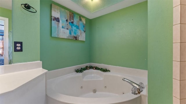 full bathroom featuring a whirlpool tub