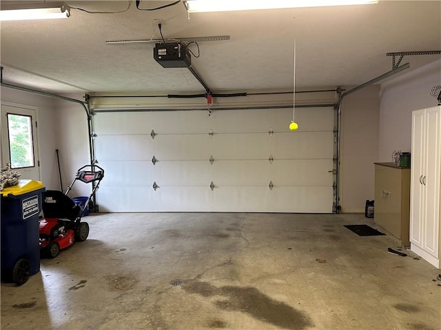 garage featuring a garage door opener