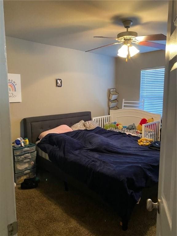 bedroom with carpet and a ceiling fan