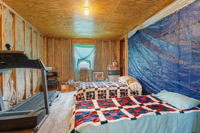 bedroom with wood ceiling and wood finished floors