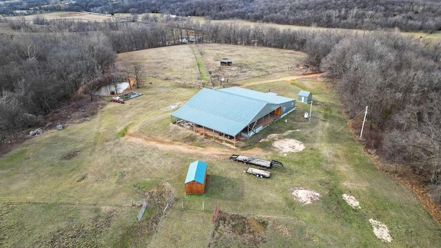 birds eye view of property with a rural view