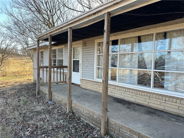 exterior space featuring brick siding