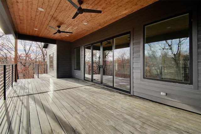 wooden deck with a ceiling fan