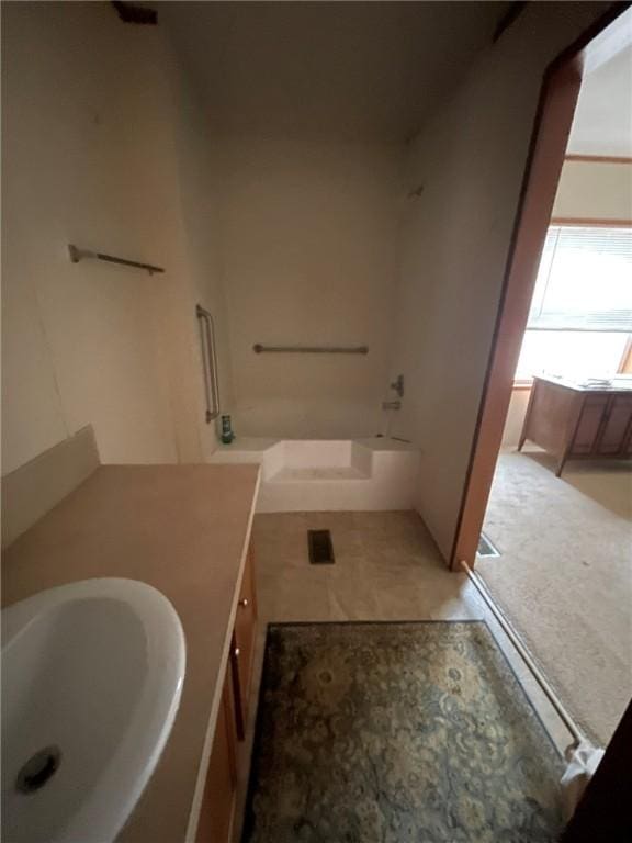 full bath featuring a washtub and vanity