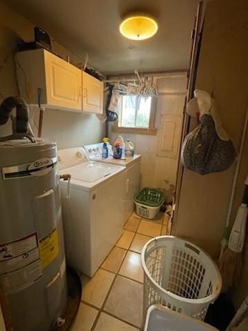 clothes washing area featuring light tile patterned floors, cabinet space, separate washer and dryer, and electric water heater