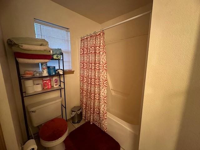 bathroom with shower / tub combo, tile patterned flooring, and toilet