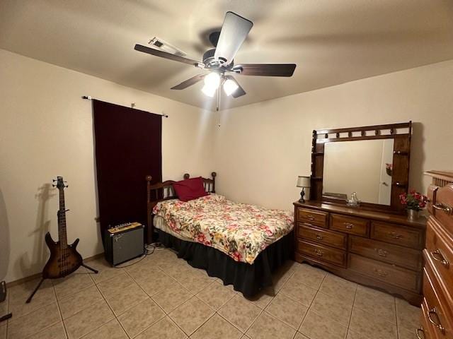 bedroom featuring a ceiling fan and light tile patterned flooring