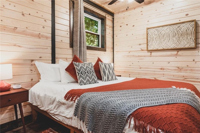 bedroom with wooden walls