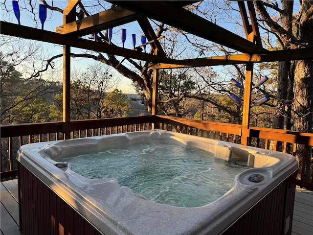 wooden deck featuring a hot tub