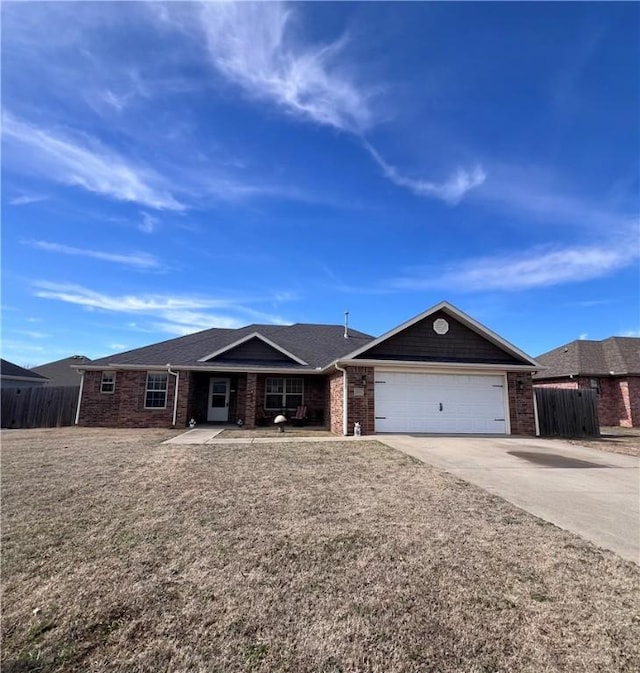 ranch-style home with brick siding, fence, a garage, and driveway