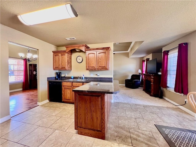 kitchen featuring open floor plan, black dishwasher, an inviting chandelier, brown cabinetry, and a textured ceiling