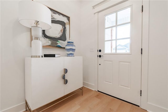 entryway featuring light wood-type flooring and baseboards