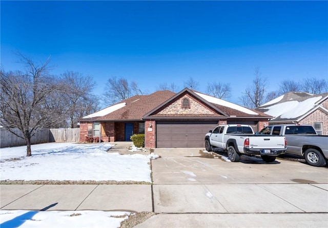 1701 Stratton Dr, Rogers, AR 72756 - view of front of home featuring a garage, brick siding, driveway, and fence