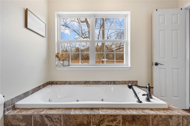 full bathroom featuring a whirlpool tub