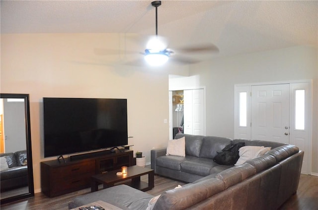 living room with dark wood-type flooring and a ceiling fan