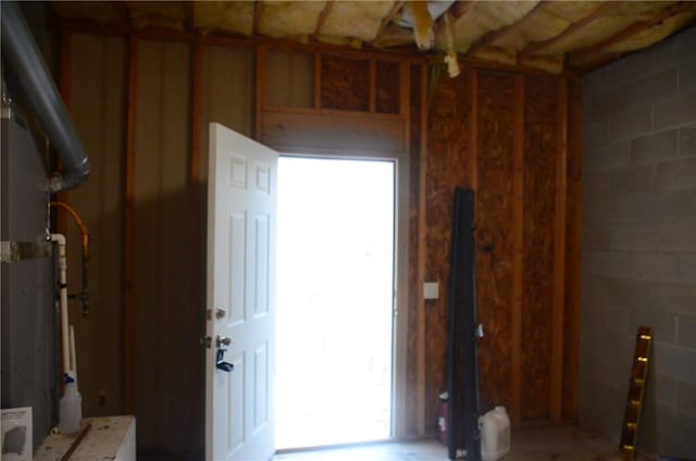 interior space with concrete block wall