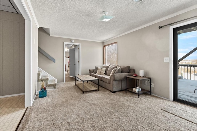 carpeted living room with stairs, crown molding, baseboards, and a textured ceiling