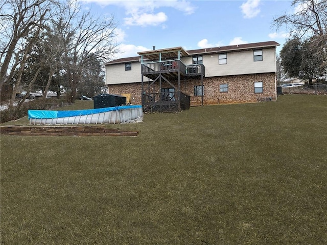 view of yard featuring a covered pool and a wooden deck